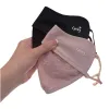 Holding a pink and black lace patchwork ice-feel sun protection breathable mask Item Picture